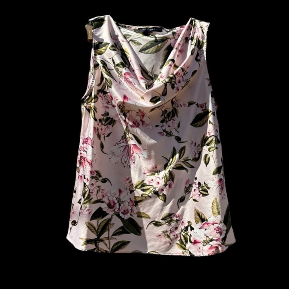 Beautiful soft and silky women’s scooped neck sleeveless shirt in flower pattern